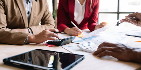 Asian business adviser meeting to analyze and discuss the situation on the financial report in the meeting room.Investment Consultant, Financial advisor and accounting concept