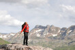 © Antonioguillem - Hiker breathing fresh air in the top of a mountain