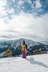 Canvas Print - man snowboarder with slovakia flag at ski resort slope