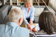 Leinwandbild Motiv Seniors sign power of attorney or contract at home
