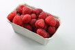 maliny w pojemniku, raspberries in a container