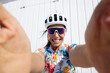 © VISTA by Westend61 - Happy cyclist taking selfie in front of wall on sunny day