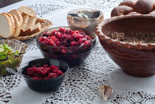 On The Table Are Kutya In A Jug, Herring, Bread, Garlic, Salad. Ukrainian Food.