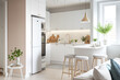 Warm pastel white and beige colors are used in the interior design of the spacious, cheerful studio apartment in the Scandinavian style. Modern touches in the kitchen and fashionable furniture in the
