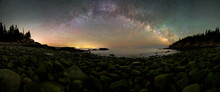 Panoramic View Of Coastline With Pebbles Under Milky Way At Night In Acadia National Park