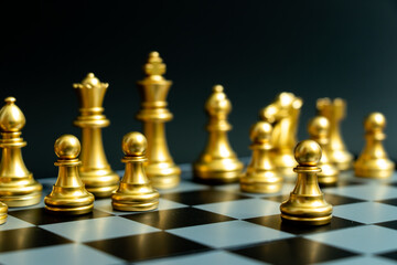 Wall Mural - Gold pawn is on the first move in chess game on black background (Concept for business decision, start or beginning project)