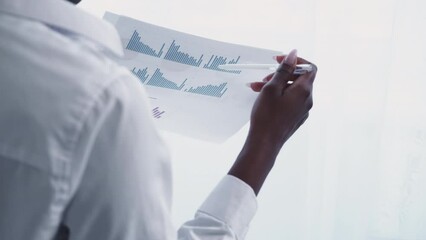 Business report. Financial statistics. Accounting expertise. Unrecognizable CEO woman studying chart graph on light white background with free space.