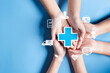© Kiattisak - Health insurance concept. hand holding plus and healthcare medical icon, health and access to welfare health concept.
