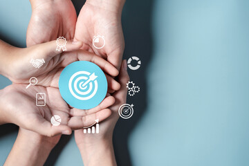 Fototapete - Business hands holding target icon, dartboard and arrow for creative and set up business objective target goal, marketing solution, target for business investment.
