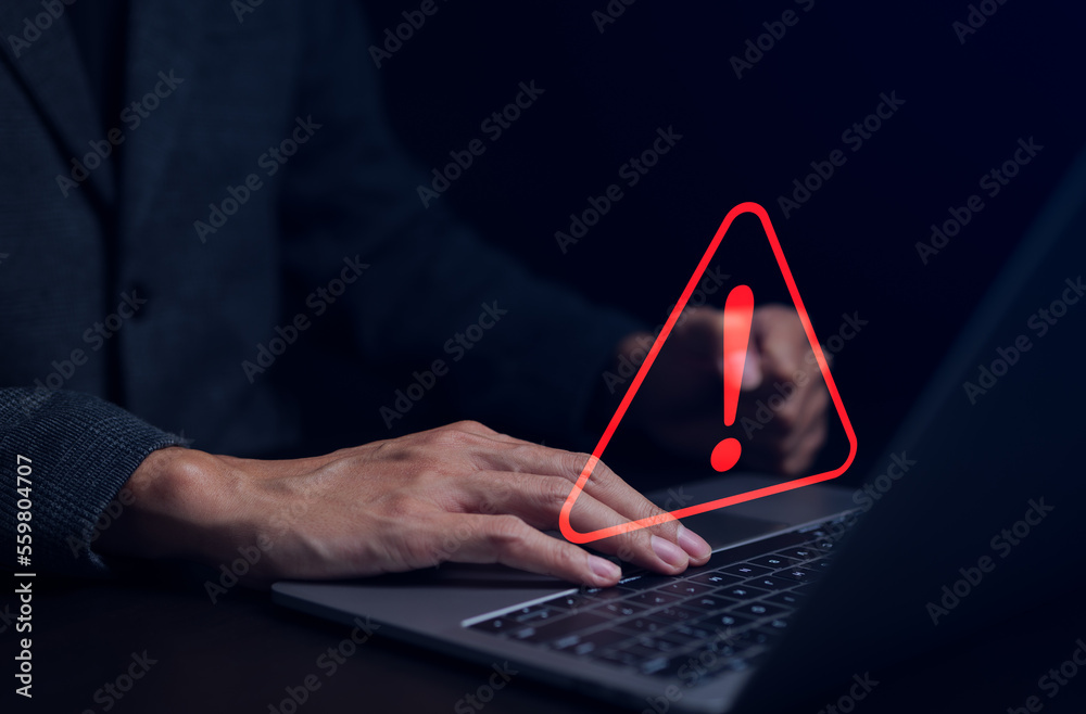 Businessman working on the computer. Warning alert system concept ...