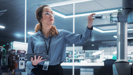 Poster - Portrait of a Young Multiethnic Female Engineer Using Tablet Computer. Interacting with a Robotic Arm Machine, Receiving a Microchip from the Hand. High Tech Industrial Laboratory Facility.
