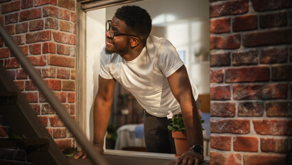 Poster - Black Man Opening his Bedroom Window in the Morning and Filling his Lungs with Fresh Air. Happy Young Male Moved to a new City Enjoying his Apartment's Location and Welcoming a New Day