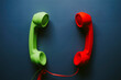 © ADDICTIVE STOCK - Red and green telephone handsets placed on table
