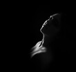 © Vera Kuttelvaserova - face of girl on a dark background with a back light