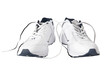 Pair of white trainers sneakers shoes in PNG isolated on transparent background