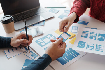 designer, programmers, developers of mobile applications work together to invent a modern mobile app