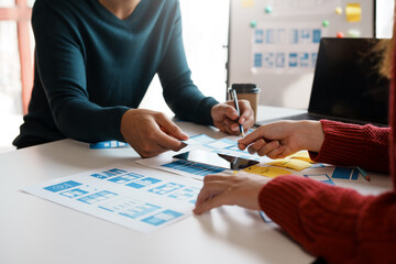 Designer, programmers, developers of mobile applications work together to invent a modern mobile application system.