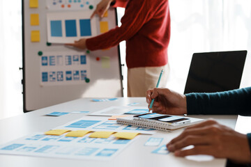 designer, programmers, developers of mobile applications work together to invent a modern mobile app