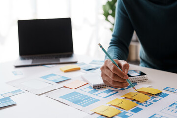 designer, programmers, developers of mobile applications work together to invent a modern mobile app