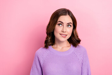 Poster - Portrait of optimistic thoughtful girl curly hairdo wear violet pullover look empty space biting lip isolated on pink color background