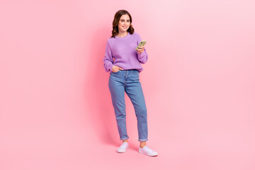 Wall Mural - Full length photo of shiny cute lady wear violet sweater typing instagram twitter facebook modern device isolated pink color background