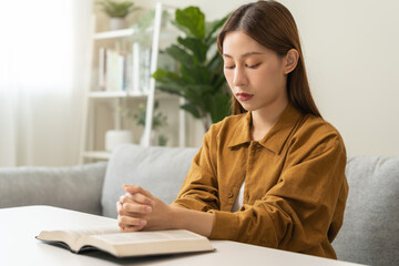 Wall Mural - Religion and believe, faith christian woman reading, holding holy bible book in hand, peace and hope of humble. Pray, prayer person meditating, praying to request God, jesus asking for help, spiritual