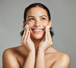 Wall Mural - skincare, beauty and woman with cotton pad for face glow, cleaning and dermatology on a grey studio 