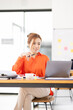 © David - Portrait young Asian woman working on laptop computer in office. documents tax business planning analyzing the financial report, business plan investment, finance analysis concept.