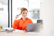 © David - Portrait young Asian woman working on laptop computer in office. documents tax business planning analyzing the financial report, business plan investment, finance analysis concept.