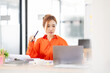 © David - Portrait young Asian woman working on laptop computer in office. documents tax business planning analyzing the financial report, business plan investment, finance analysis concept.