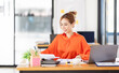 © David - Portrait young Asian woman working on laptop computer in office. documents tax business planning analyzing the financial report, business plan investment, finance analysis concept.