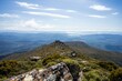 hiking up to the summit of a rocky mountain in australia