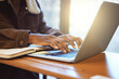 © S Fanti/peopleimages.com - Hands, student and black woman typing on laptop working on assignment project. Learning, education pc and female learner on computer writing email, researching or course planning on table in house.