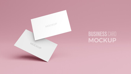 Mockup of blank business card at pink isolated background.