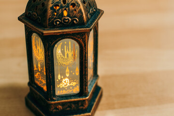 Wall Mural - Arabic lantern with burning candle. close up.