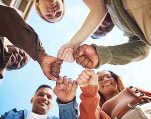 Sticker - Group of friends, hands bump in huddle and group diversity, team building circle from below. Friendship, happiness and university students in fist bump, men and women smile together on college campus