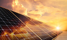 Solar Panels Reflect A Golden Sky, Clean Energy, And A Good Environment.