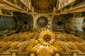 Wall Mural - Gorgeously decorated altar and frescoes on walls in the interior of Holy Dormition Cathedral in Pechersk Lavra, Kyiv