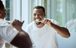 Morning, happy and black man brushing teeth in bathroom for health, hygiene and clean smile. Self care, cleaning and oral hygiene for healthy teeth of person smiling with confidence in home.