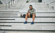 © S Fanti/peopleimages.com - Social media, phone or black man on steps after fitness training, exercise or workout with a sports bag in Miami, Florida. Social networking, happy or healthy athlete texting, chat or typing online