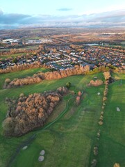 Wall Mural - Aerial view of residential neighbourhoods surrounded by green space and countryside. Taken in Bury Lancashire England. 