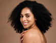 Happy woman, afro hairstyle and face skincare on studio background in self love hug, healthcare wellness grooming or body dermatology. Portrait, smile or beauty model, natural curly style and makeup