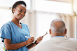 © C Davids/peopleimages.com - Consulting, medical and checklist with old man and nurse for retirement, rehabilitation or physical therapy. Help, empathy and healing with patient and black woman in nursing home for healthcare exam