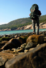 A Backpacker On The Coast Of Maine In Acadia National Park.