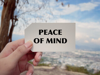 Wall Mural - Motivational and inspirational wording. Peace of mind written on a blurred vintage styled background.