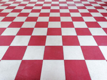 Red And White Tiled Floor Symmetrical With Grid Texture In Perspective View For Background.Permanent Tiled Floor. Red White Square Made Of Floor Ceramic Material