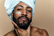 Image of a young man taking care of his skin. Beauty studio shot about skin care and products for the personal hygiene.