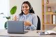 © Kirsti D/peopleimages.com - Video call, laptop and seminar with a business indian woman meeting online while sitting in her office at work. Remote work, headset and communication with a female employee talking in a webinar