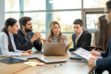 Corporate business team and manager in a meeting in modern office