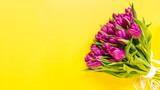 Fototapeta Tulipany - Beautiful romantic bouquet of pink tulips on the yellow background. Lots of tulips, large bouquet. Valentines day, Womens day or Mothers day celebration concept. Copy space
